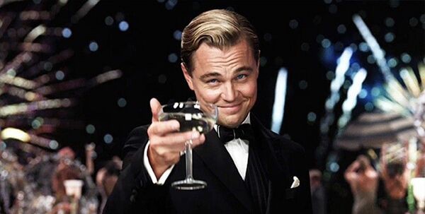 Create meme: Leonardo DiCaprio with a glass of, Leonardo DiCaprio the great Gatsby, Leonardo DiCaprio raises a glass