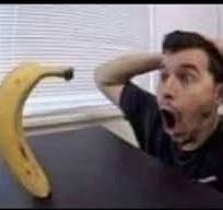 Create meme: banana is funny, a man is surprised by a banana, man with a banana