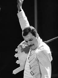 Create meme: Freddie mercury hand up, Freddie mercury pose, Freddie mercury Bohemian Rhapsody
