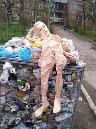 Create meme: In the trash, The doll is in the trash, A rubber woman in the trash