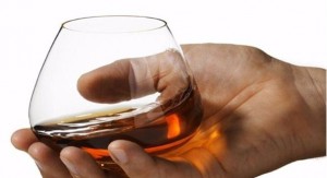 Create meme: cognac pour into the glass, a glass of brandy without legs, glass in hand, photo PNG