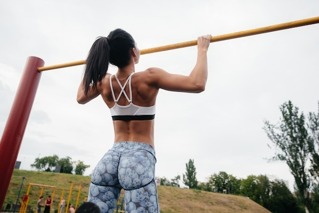 Create meme: the girl pulls herself up on the horizontal bar, the girl on the bar , priest 