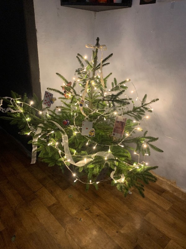 Create meme: decorated Christmas tree , a Christmas tree decorated with a garland, garland on the Christmas tree