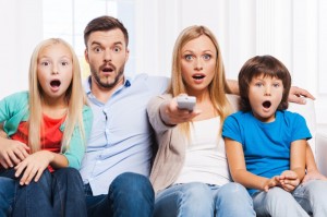 Create meme: feet, family watching TV, the family in front of the TV