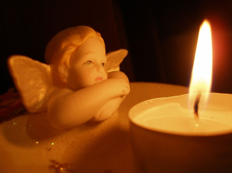 Create meme: angel with a candle, mourning candle, the candle of memory
