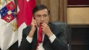 Create meme: Saakashvili eat a tie, Saakashvili chewing his tie, Mikheil Saakashvili