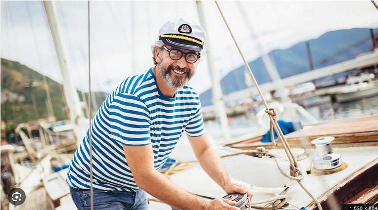 Create meme: the captain of the ship, a man at the helm of a yacht, people on the yacht