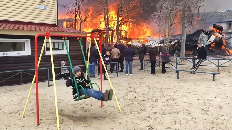 Create meme: swing on the background of a fire, the house is on fire the boy on the swing, swing 