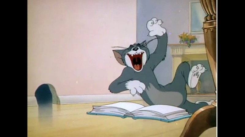 Create meme: cats from Tom and Jerry, Tom and Jerry the black cat, Tom laughs at the book