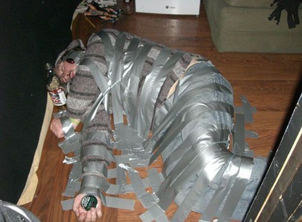 Create meme: taped together, the man is taped to the wall, A boy tied up with duct tape