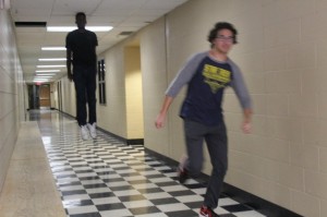 Create meme: flying man at the corridor behind the fleeing man meme, School, levitating black guy meme