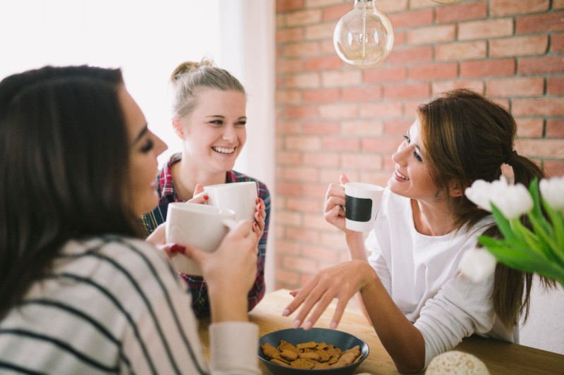 Create meme: The girl is drinking tea, girlfriends with coffee, women drink coffee and laugh