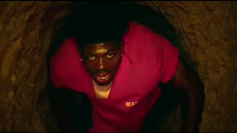 Create meme: lil nas x crawls through the tunnel, a black man crawls through a tunnel clip, the negro crawls through the tunnel