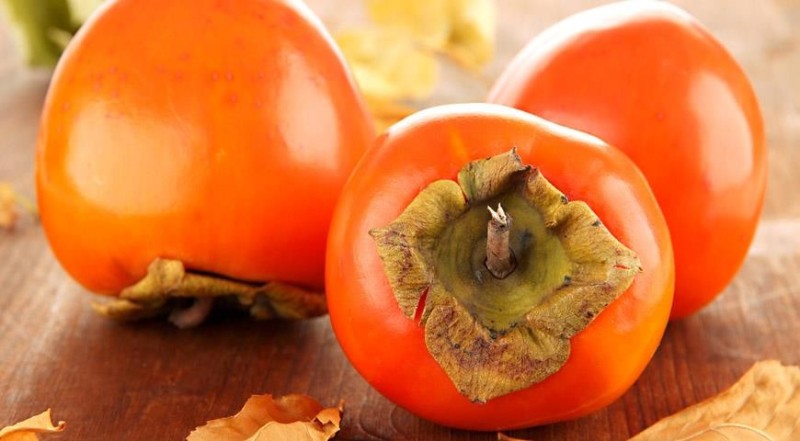 Create meme: persimmon , persimmon with eyes, ripe persimmon