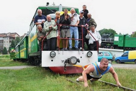 Create meme: a man pulls a train, uzd of Mezinovsky peat enterprise Vladimir region, male 