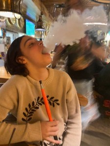 Create meme: woman, vaping, girl