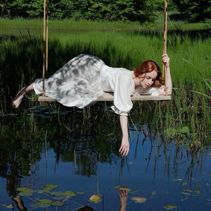 Create meme: realistic drawings, conceptual photography, a woman on a swing