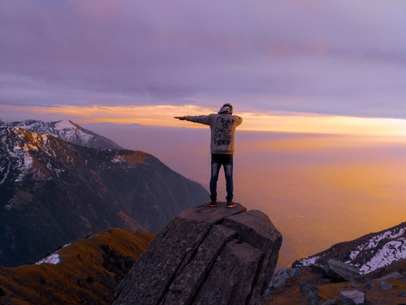 Create meme: a man in the mountains, success at the top of the mountain, jubilation at the top of the mountain