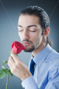 Create meme: man with flowers, a man with a rose in his mouth
