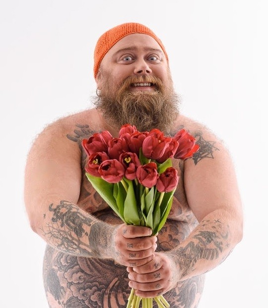 Create meme: male , a man with flowers, brutal man with flowers