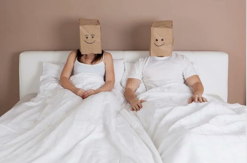 Create meme: I'm lying in bed, In bed, A couple with a bag on their head