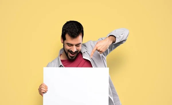 Create meme: male , The man with the white poster, a man holds a poster