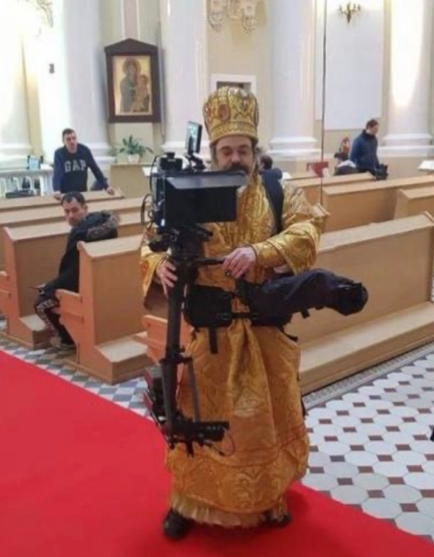 Create meme: The cameraman from God is a priest with a camera, The operator is from God, Father with a camera