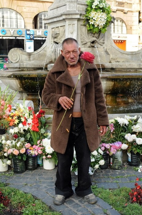 Create meme: the bum in the fur coat, homeless man Slavik, a homeless man with a flower