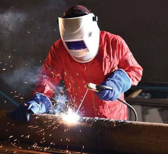 Create meme: welder of manual arc welding with a melting coated electrode, arc welding, manual arc welding