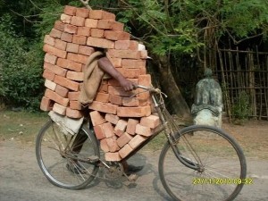Create meme: necessity is the mother of invention, bricks funny pictures, the bike carries the bricks