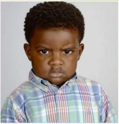 Create meme: angry black kid, angry boy, angry kid