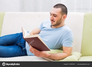 Создать мем: reading book, мужик держится за диван, smile man