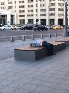 Create meme: Kazan homeless, bum on the bench, photo lying on the sidewalk
