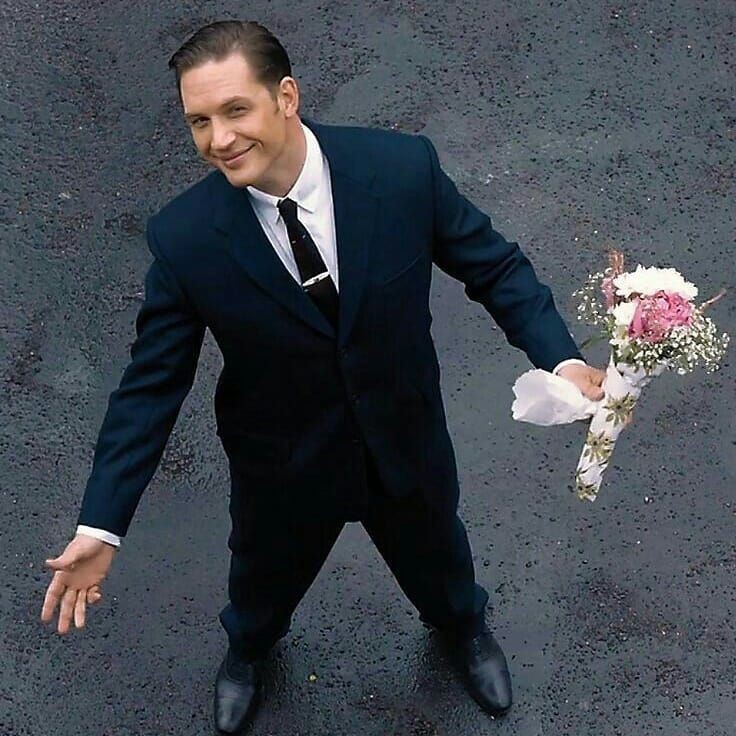 Create meme: people , tom hardy with a bouquet, tom hardy legend with flowers