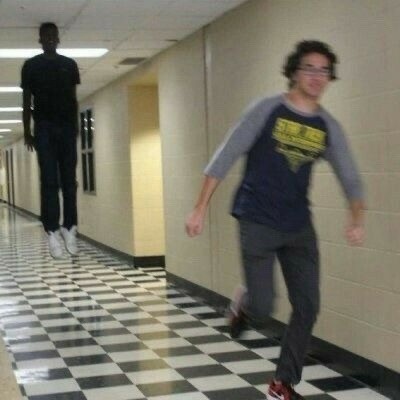 Create meme: a man runs down the corridor of the meme, the guy runs down the corridor of the meme, A meme of a man running away from a flying man in the hallway