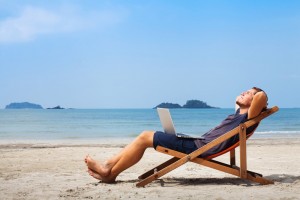 Create meme: man on a sun lounger, laptop on the beach, relaxing on the beach