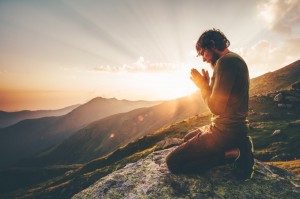 Create meme: a praying man, sunset mountains