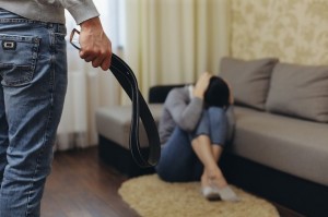 Create meme: domestic violence, punishment with a belt, a woman with a belt in her hands