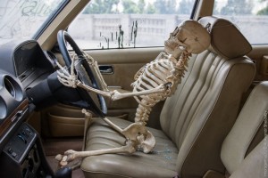 Create meme: picture the skeleton in the car