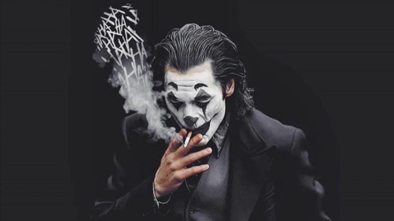 Create meme: Joker Joaquin Phoenix smokes, joker on a black background, Joker 