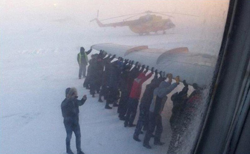 Create meme: pushing the plane in igarka, passengers push the plane in igarka, pushing a plane in Russia
