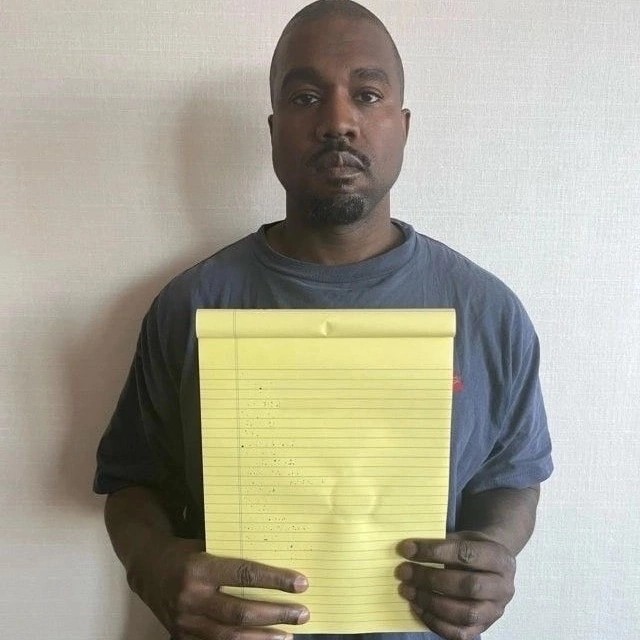 Create meme: Kanye West , Kanye West with a leaflet, text page