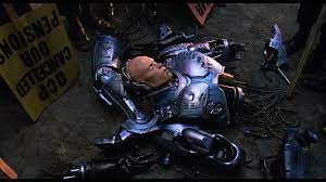 Создать мем: robocop, робокоп 1987 18 + момент, робокоп раненый