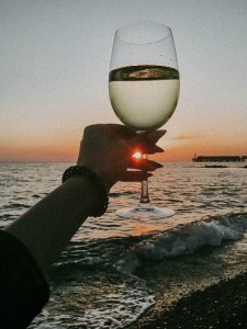 Create meme: bottle, sea sunset, sea and glass of wine pictures vertically