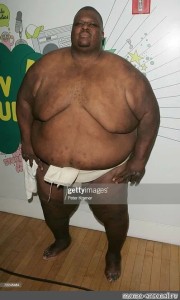 Создать мем: жирный афроамериканец, негр сумоист, самый толстый негр