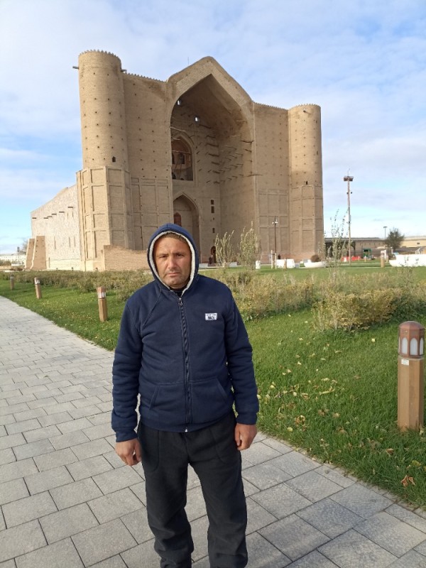 Создать мем: казахстан, человек, мавзолей ходжа ахмета яссауи