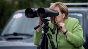 Create meme: Merkel looks through binoculars, Merkel binoculars