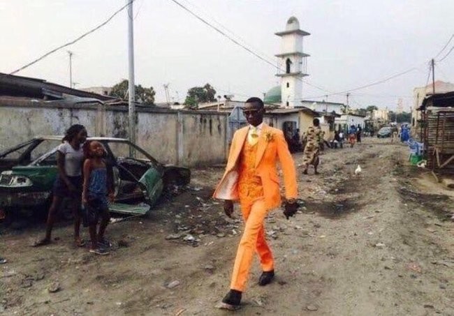 Create meme: dandies from Congo, africa negroes, a black man in an orange suit