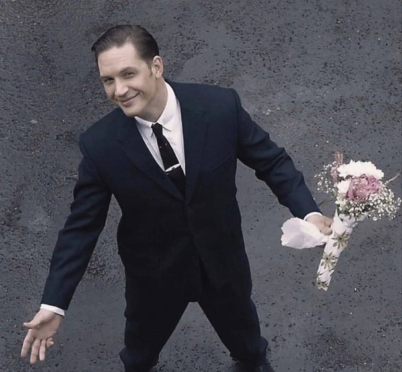 Create meme: the legend movie with tom hardy flowers, tom hardy with a bouquet, Tom hardy is a legend