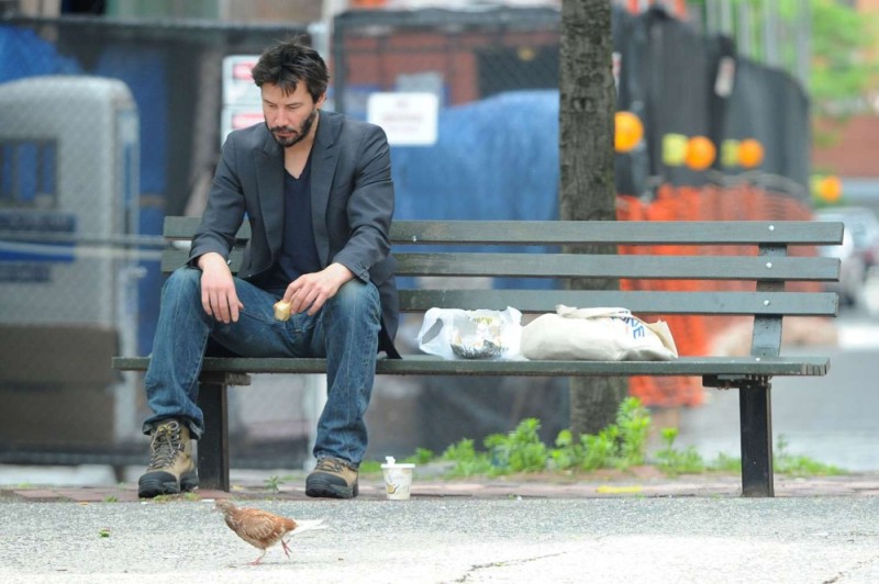 Create meme: Keanu Reeves on the bench, Keanu Reeves on a bench, Keanu Reeves is sitting on a bench